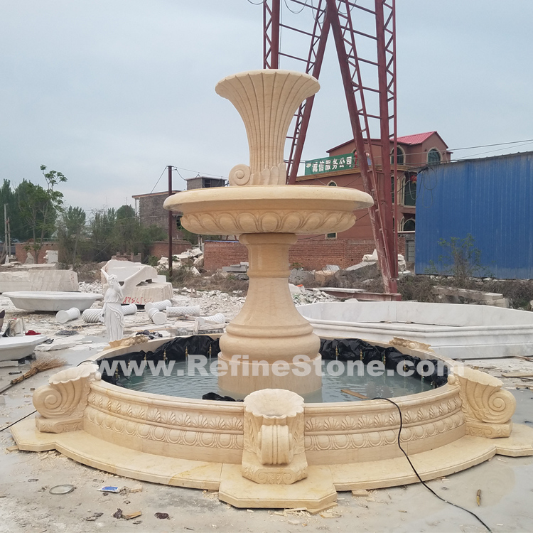 Gold yellow marble stone fountain